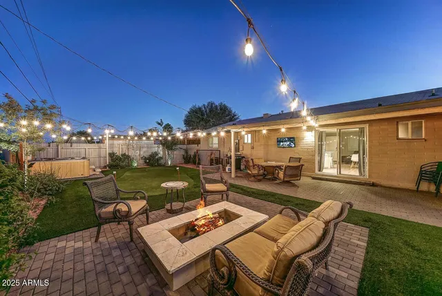 a view of yard with patio