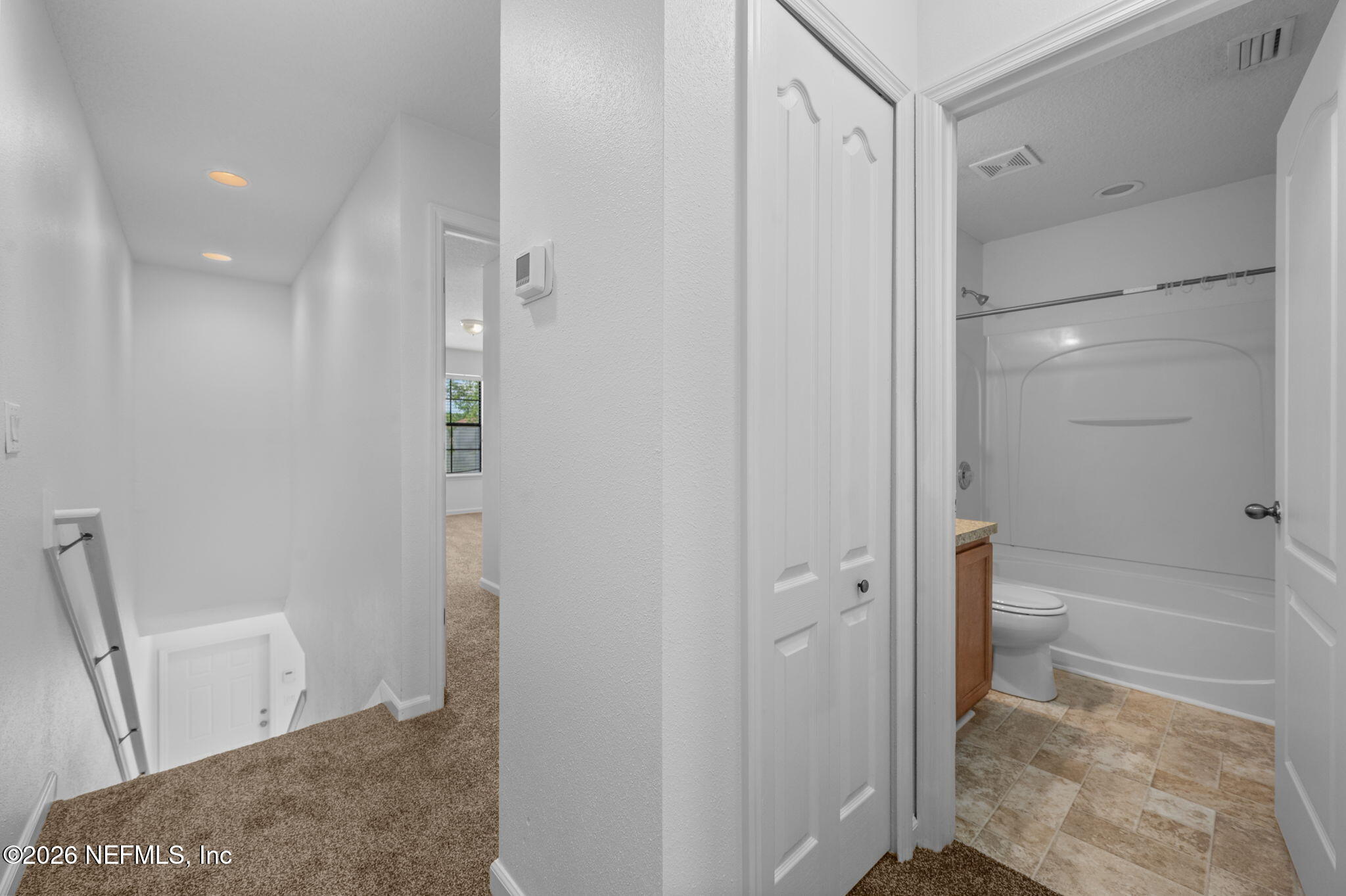 253 Syrah Way St. Augustine, FL 32084 - Photo 31 of 39 a bathroom with a bathtub and a shower