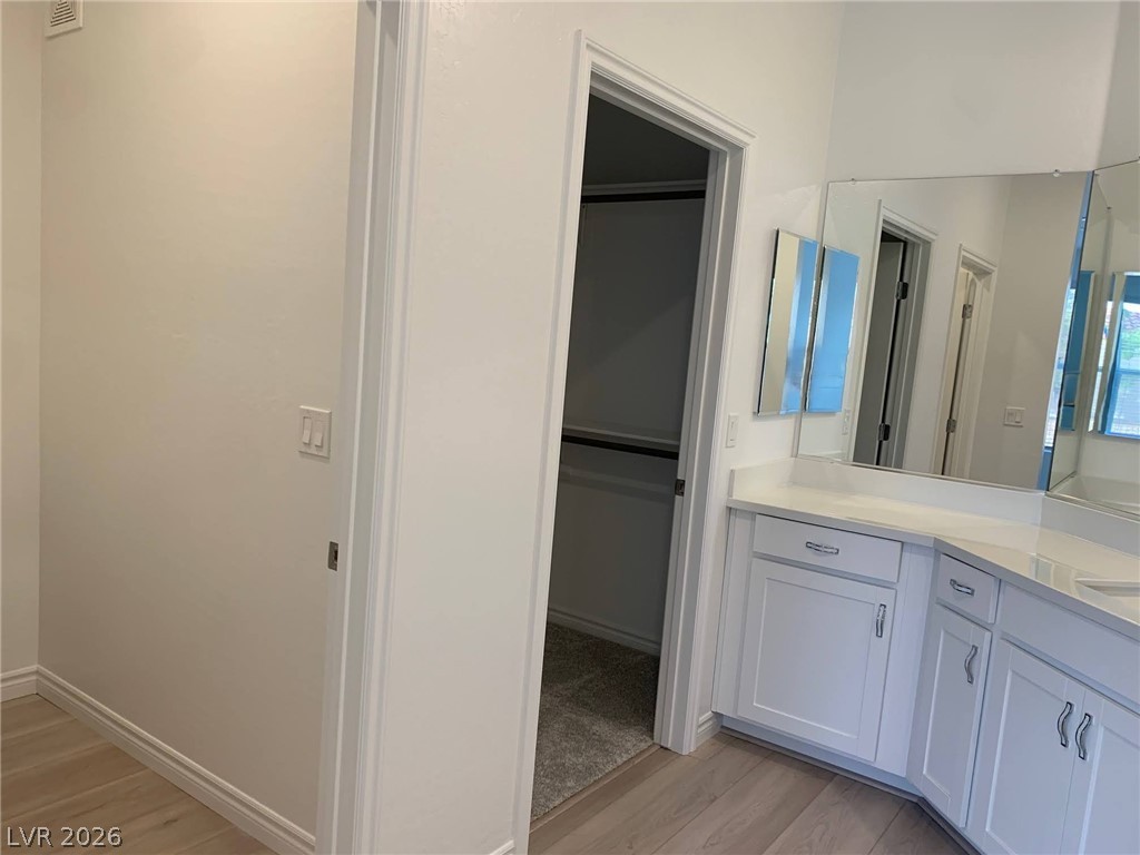 2555 Hampton Road, Unit 7109 Henderson, NV 89052 - Photo 27 of 34 Ample counter space and pristine cabinetry define this well-appointed bathroom area.