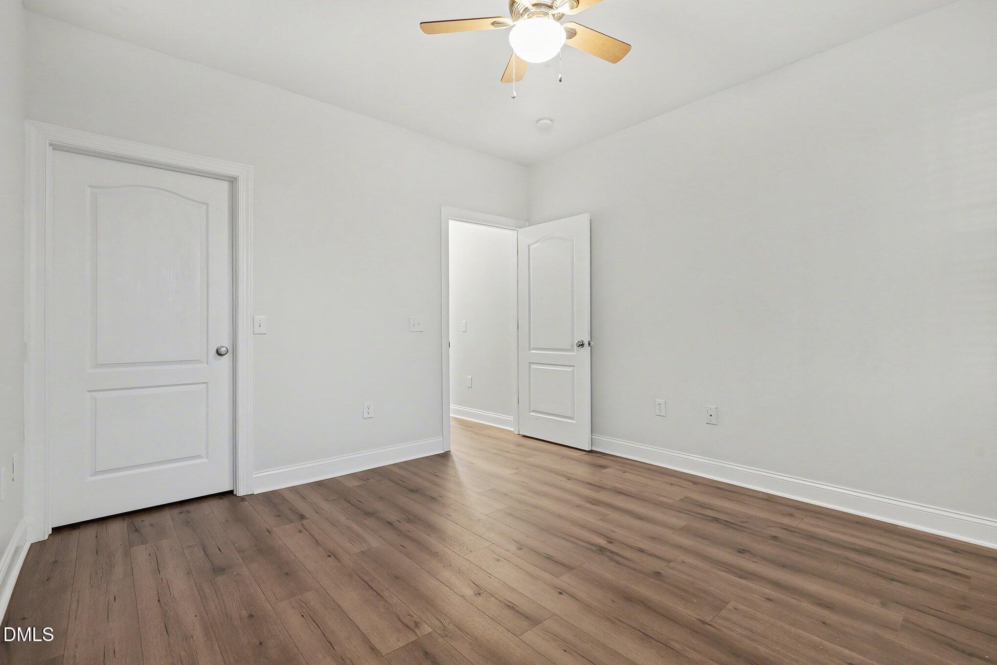 2810 Bedford Green Drive, Unit 207 Raleigh, NC 27604 - Photo 12 of 20 a view of an empty room with wooden floor