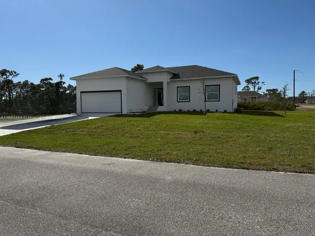 a house view with a garden space