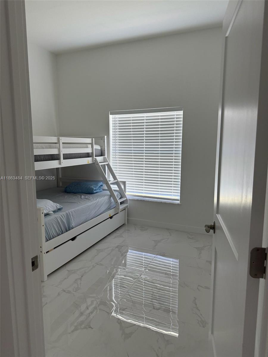 63 Coxswain Circle, Unit 63 Placida, FL 33946 - Photo 12 of 12 a living room with furniture and a window