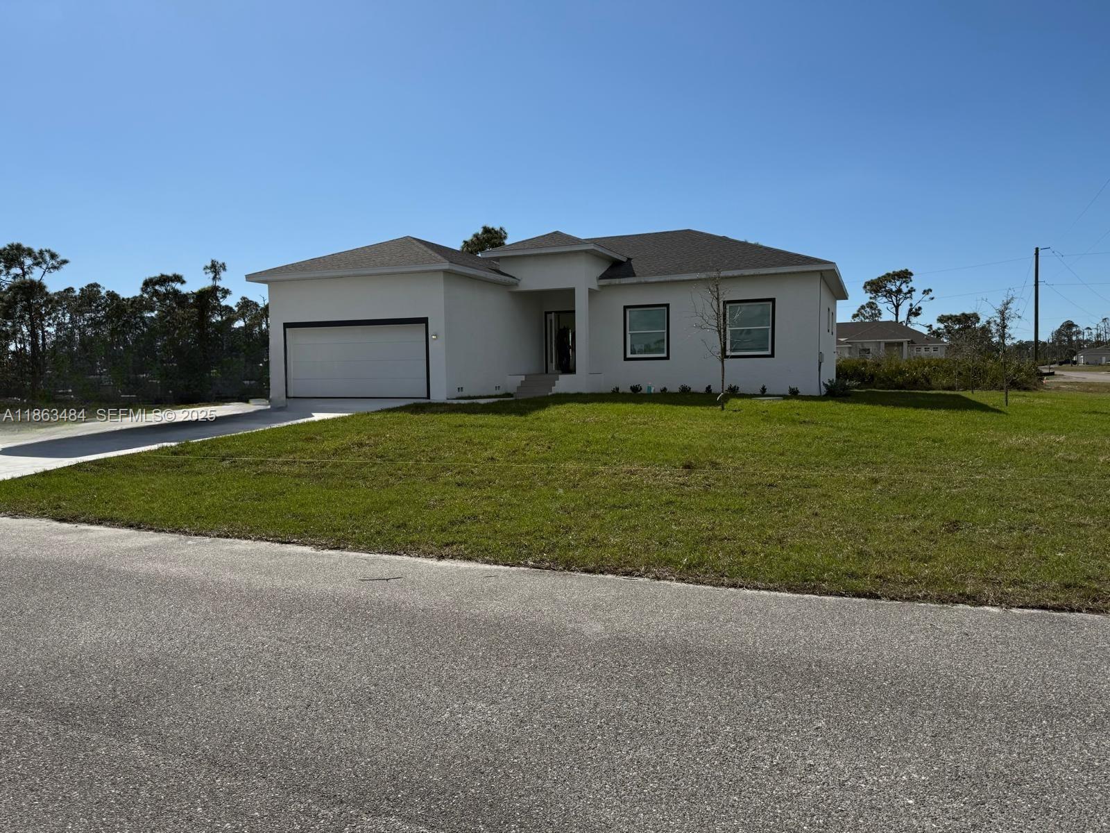 63 Coxswain Circle, Unit 63 Placida, FL 33946 - Photo 2 of 12 a house view with a garden space
