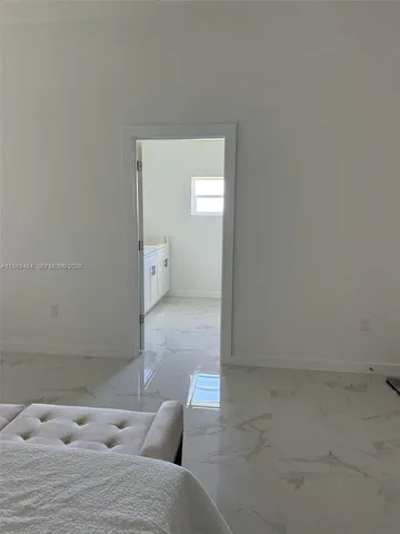 a utility room with cabinets washer and dryer