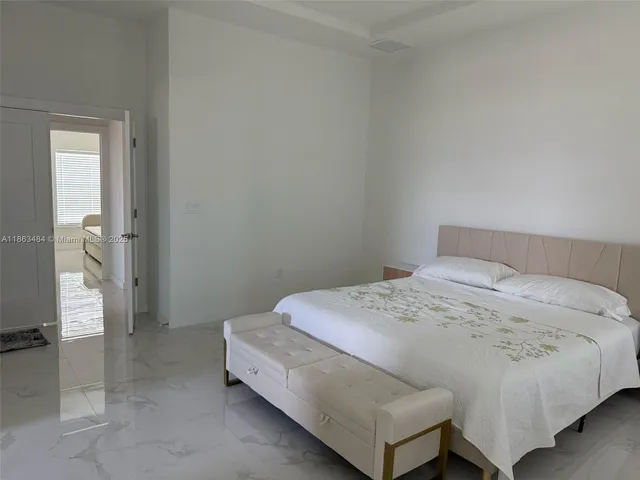 a view of a hallway with wooden shelves