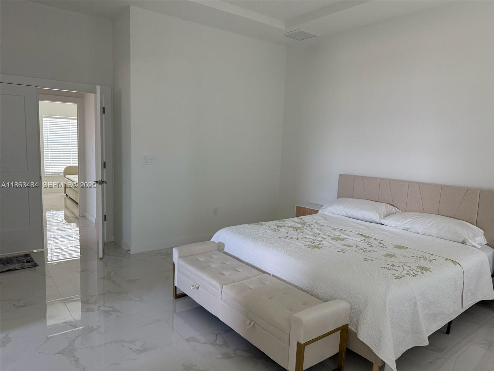 63 Coxswain Circle, Unit 63 Placida, FL 33946 - Photo 10 of 12 a bedroom with a bed and a cabinets