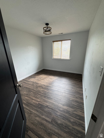 1237 South 260 West Payson, UT 84651 - Photo 44 of 81 Spacious room featuring wood-finish flooring, a window with horizontal blinds, and a modern ceiling-mounted light fixture