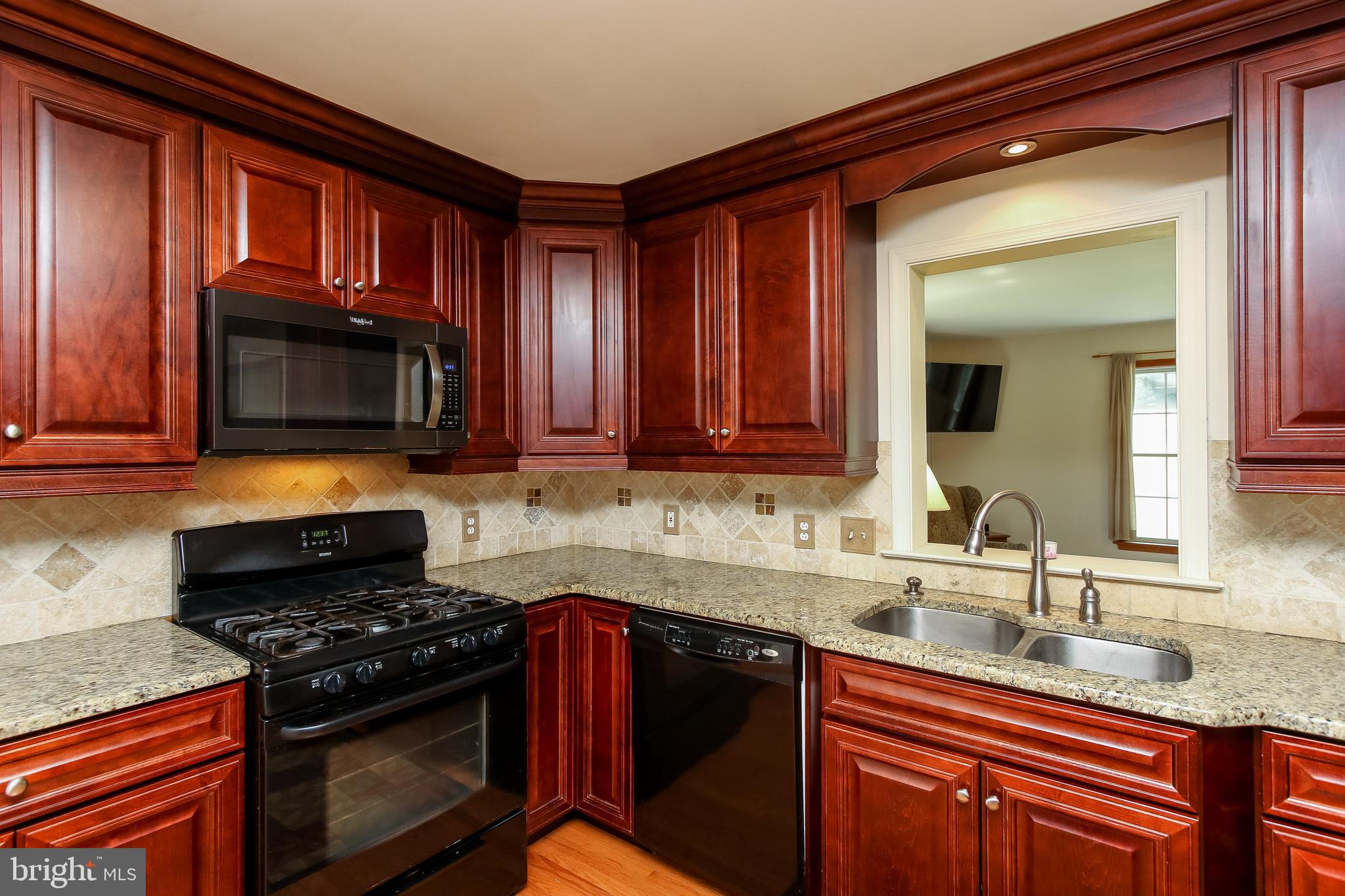 711 North Gorsuch Road Westminster, MD 21157 - Photo 12 of 55 Maple wood cabinets, ceramic tile backsplash...