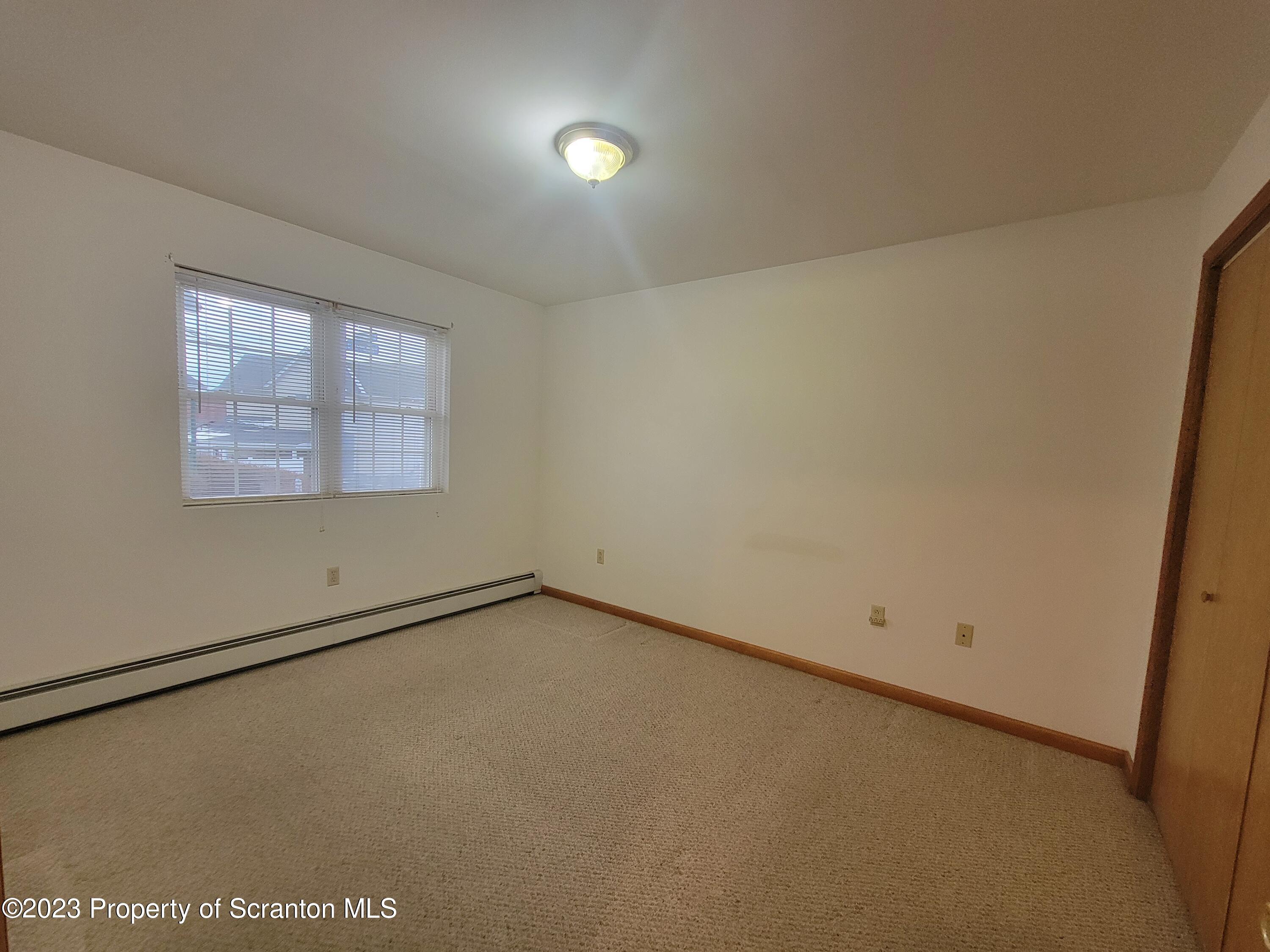 128 Mortimer Street, Unit 2R Dunmore, PA 18512 - Photo 6 of 7 an empty room with a window