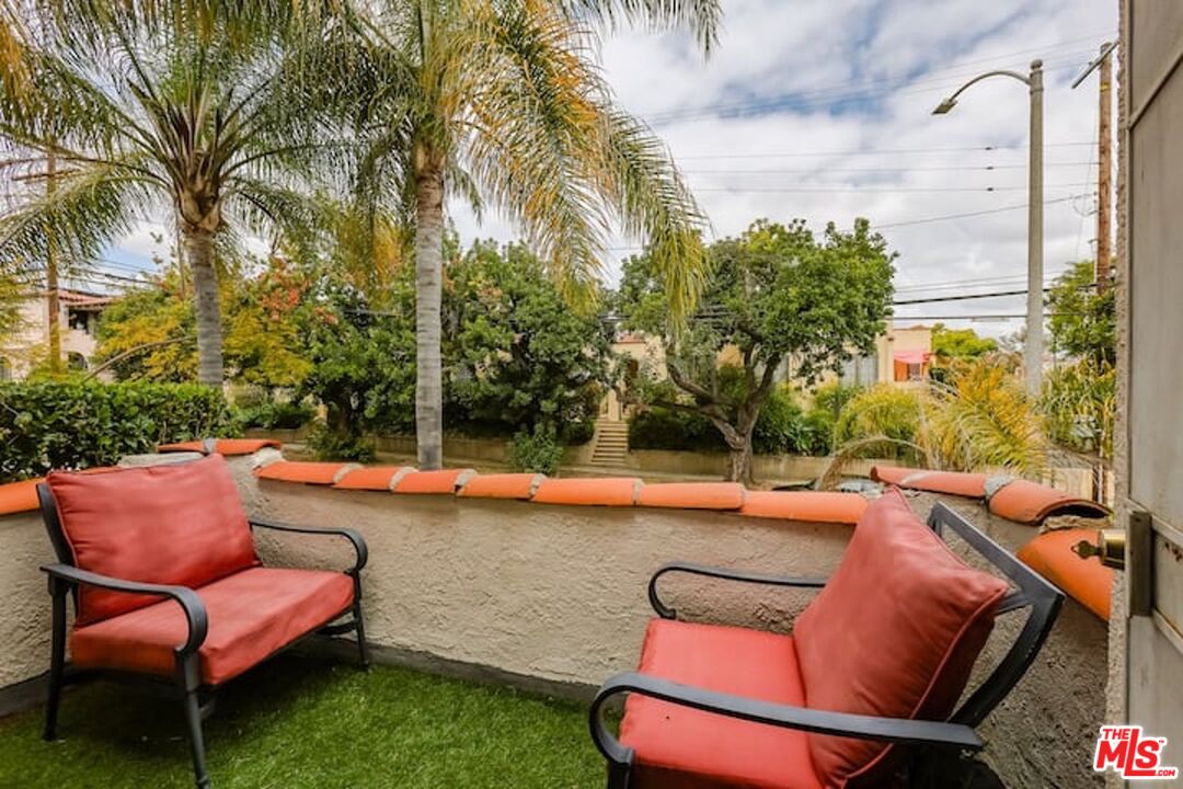 1203 South Rimpau Boulevard Los Angeles, CA 90019 - Photo 10 of 21 a view of a backyard with swimming pool and sitting area