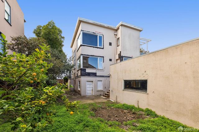 a front view of residential houses with yard