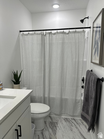 7927 Bristlecone Road, Unit 204 Eagle Mountain, UT 84005 - Photo 13 of 19 Full bathroom with vanity, shower / bath combo, a textured ceiling, and light marble finish floors
