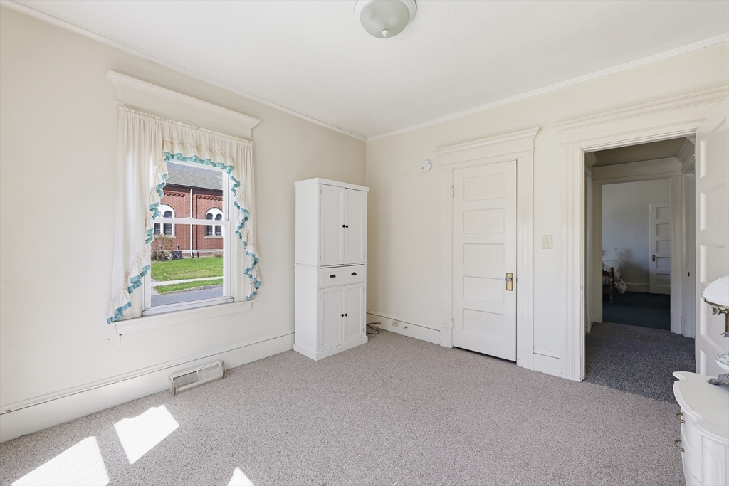 367 Broadway Street, Unit 1 Chicopee, MA 01020 - Photo 11 of 18 an empty room with windows and closet