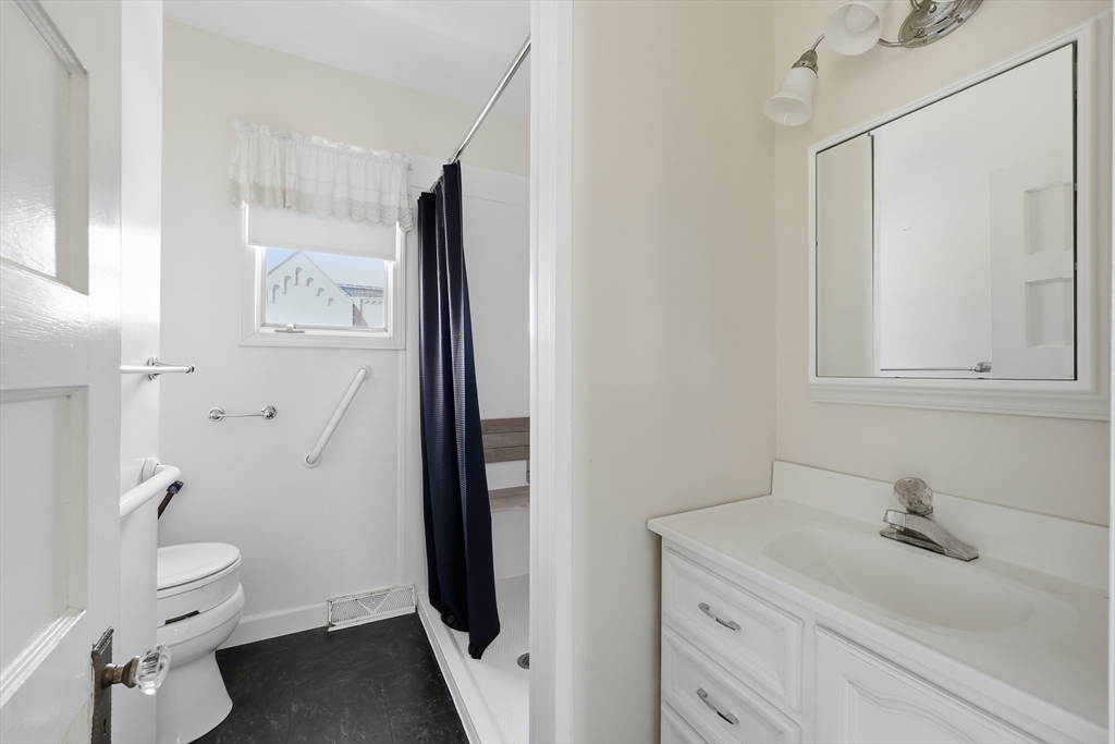367 Broadway Street, Unit 1 Chicopee, MA 01020 - Photo 12 of 18 a bathroom with a granite countertop sink toilet and shower