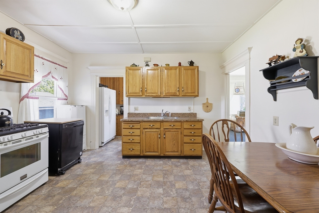 367 Broadway Street, Unit 1 Chicopee, MA 01020 - Photo 16 of 18 a kitchen with a stove a sink and a refrigerator