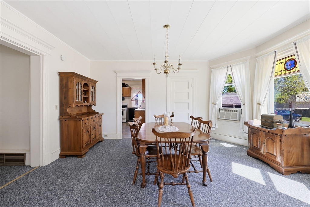 367 Broadway Street, Unit 1 Chicopee, MA 01020 - Photo 6 of 18 a view of a dining room with furniture and chandelier