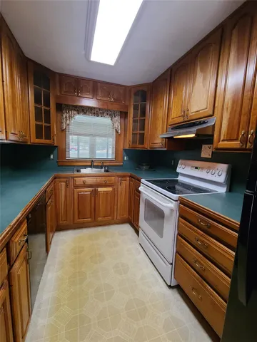 a living room with furniture a window and a fireplace