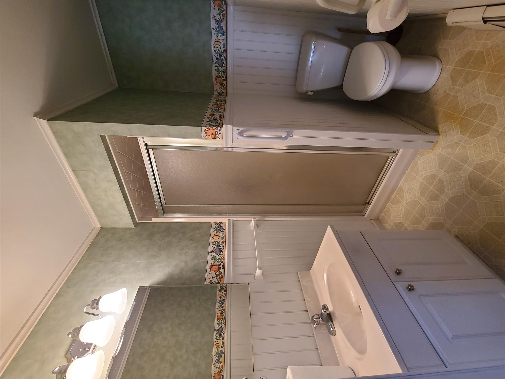 493 Old Taylor Road Jeffersonville, NY 12748 - Photo 17 of 35 a bathroom with a sink a toilet and shower