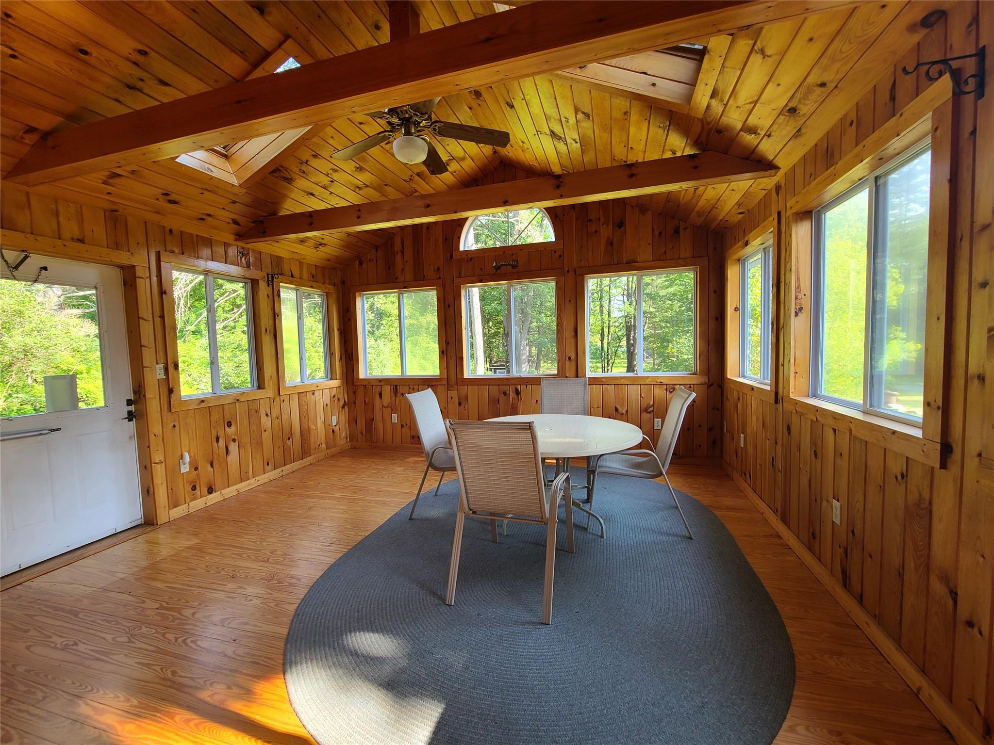 493 Old Taylor Road Jeffersonville, NY 12748 - Photo 6 of 35 a dining room with furniture a chandelier and wooden floor