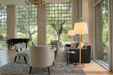 a living room view with a table and chairs