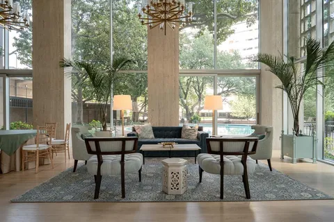 a living room with furniture and flowers