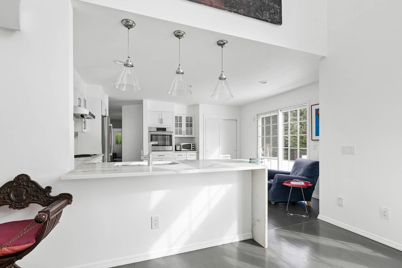 61 Swans Neck Lane Water Mill, NY 11976 - Photo 12 of 33 a living room with stainless steel appliances kitchen island granite countertop furniture and a window