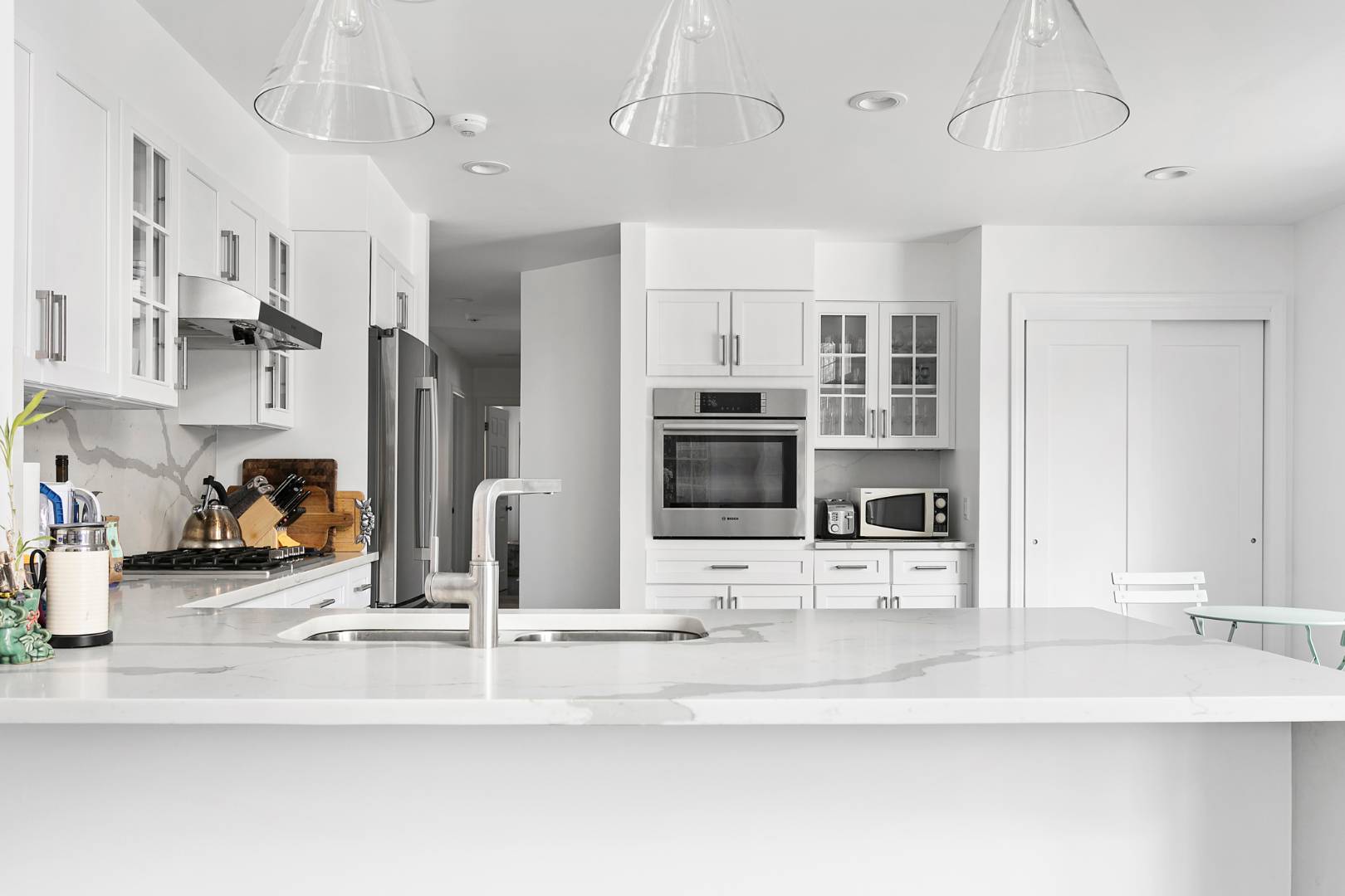 61 Swans Neck Lane Water Mill, NY 11976 - Photo 13 of 33 a kitchen with stainless steel appliances kitchen island granite countertop a sink and cabinets