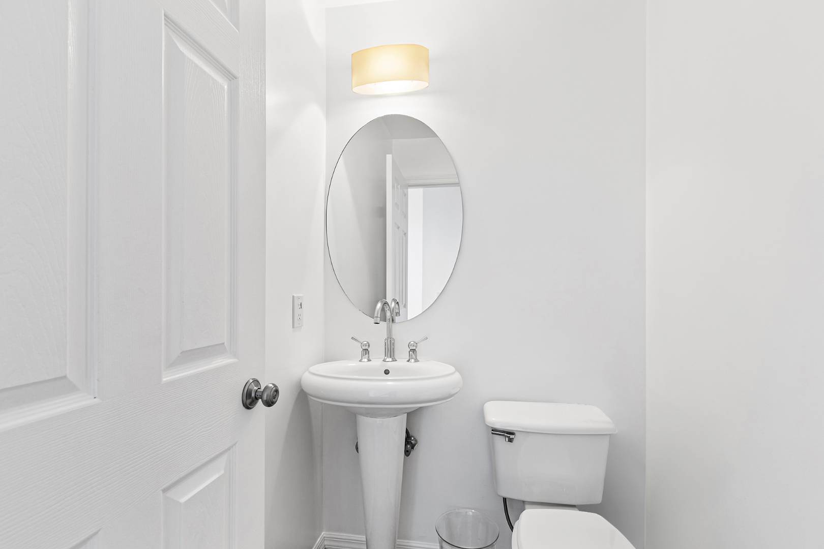 61 Swans Neck Lane Water Mill, NY 11976 - Photo 16 of 33 a bathroom with a toilet sink and mirror