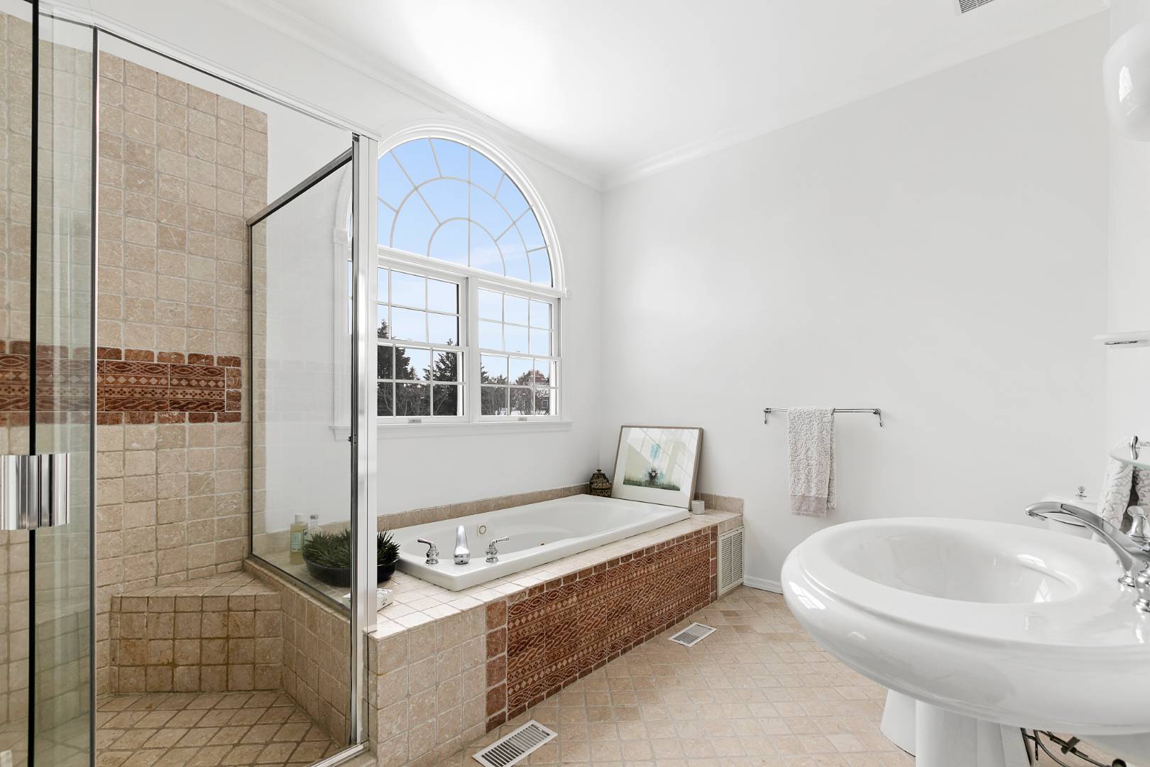 61 Swans Neck Lane Water Mill, NY 11976 - Photo 23 of 33 a bathroom with a sink and a mirror