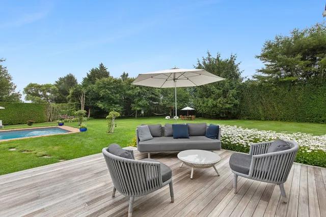 a view of a patio with a patio table and chairs