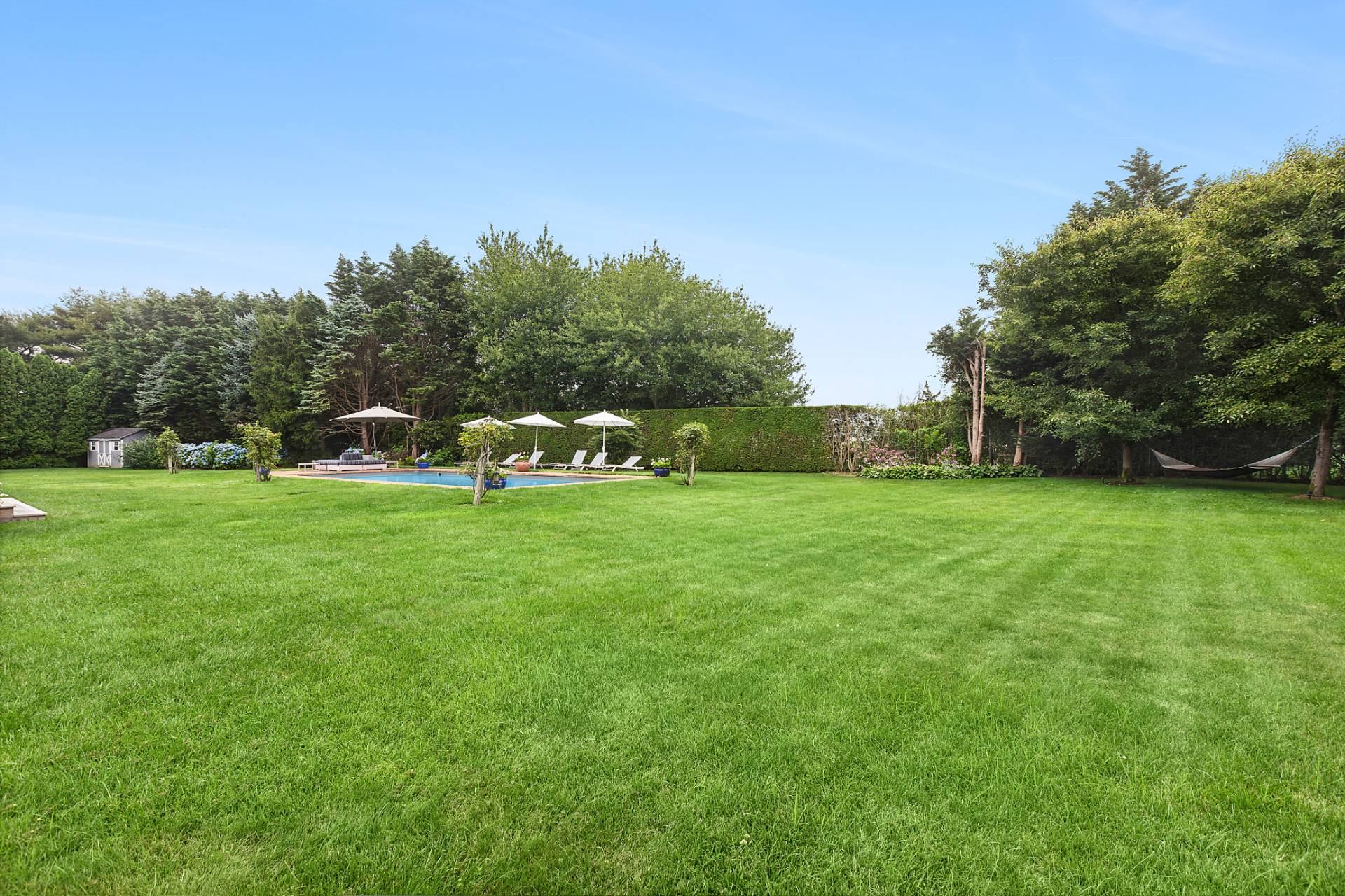 61 Swans Neck Lane Water Mill, NY 11976 - Photo 31 of 33 a view of field with trees in the background
