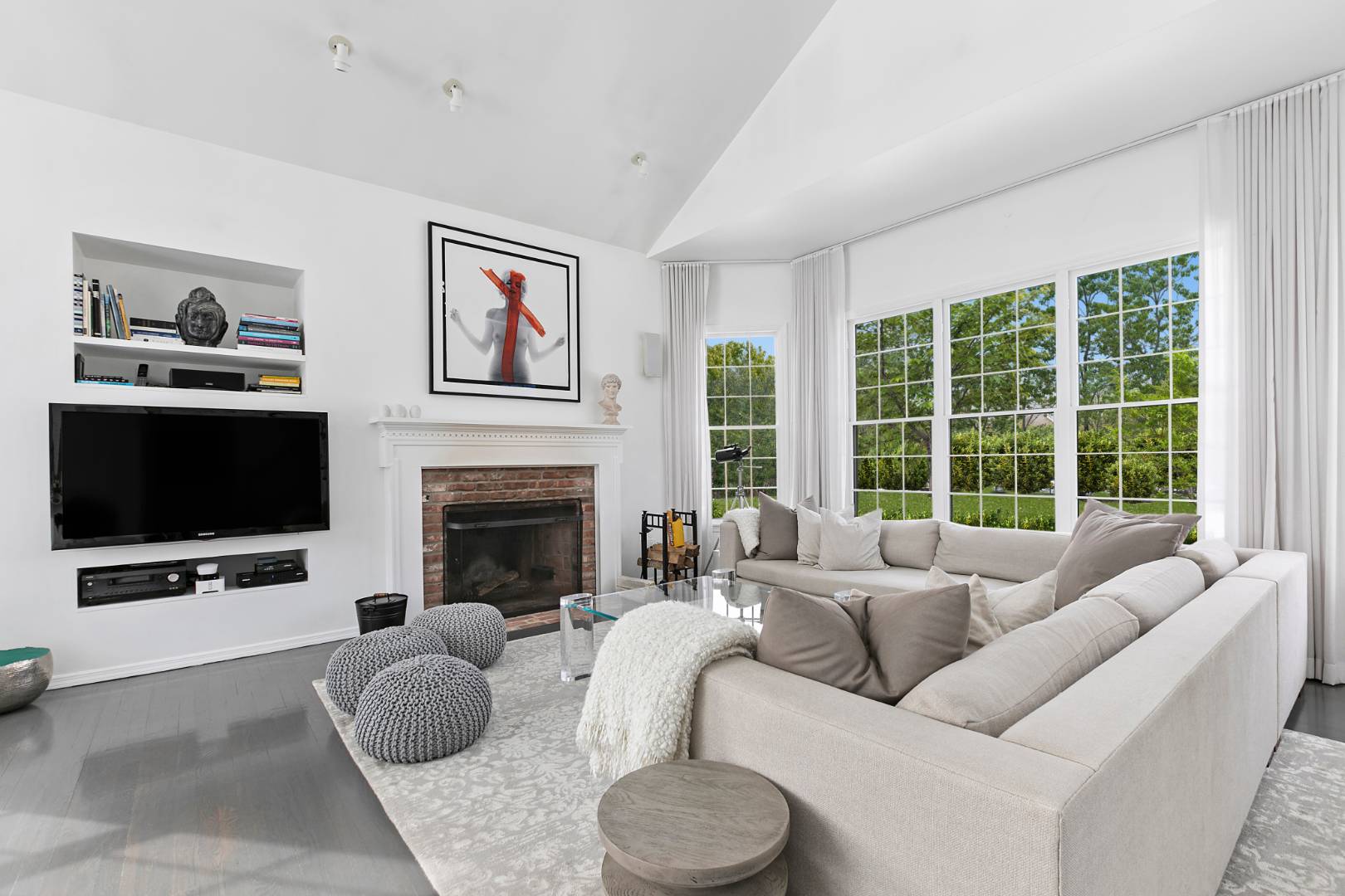61 Swans Neck Lane Water Mill, NY 11976 - Photo 10 of 33 a living room with furniture a large window and a flat screen tv