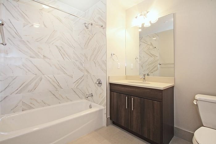 100 Marshall Street, Unit 508 Hoboken, NJ 07030 - Photo 7 of 9 a bathroom with a sink a toilet and bathtub