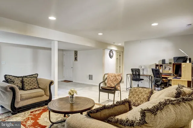 a living room with furniture and a table