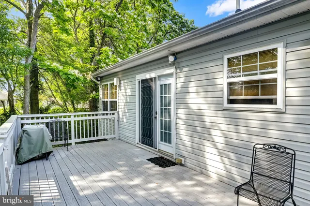 a view of a porch with wooden floor