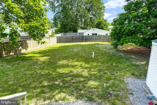 a view of a yard with a small house