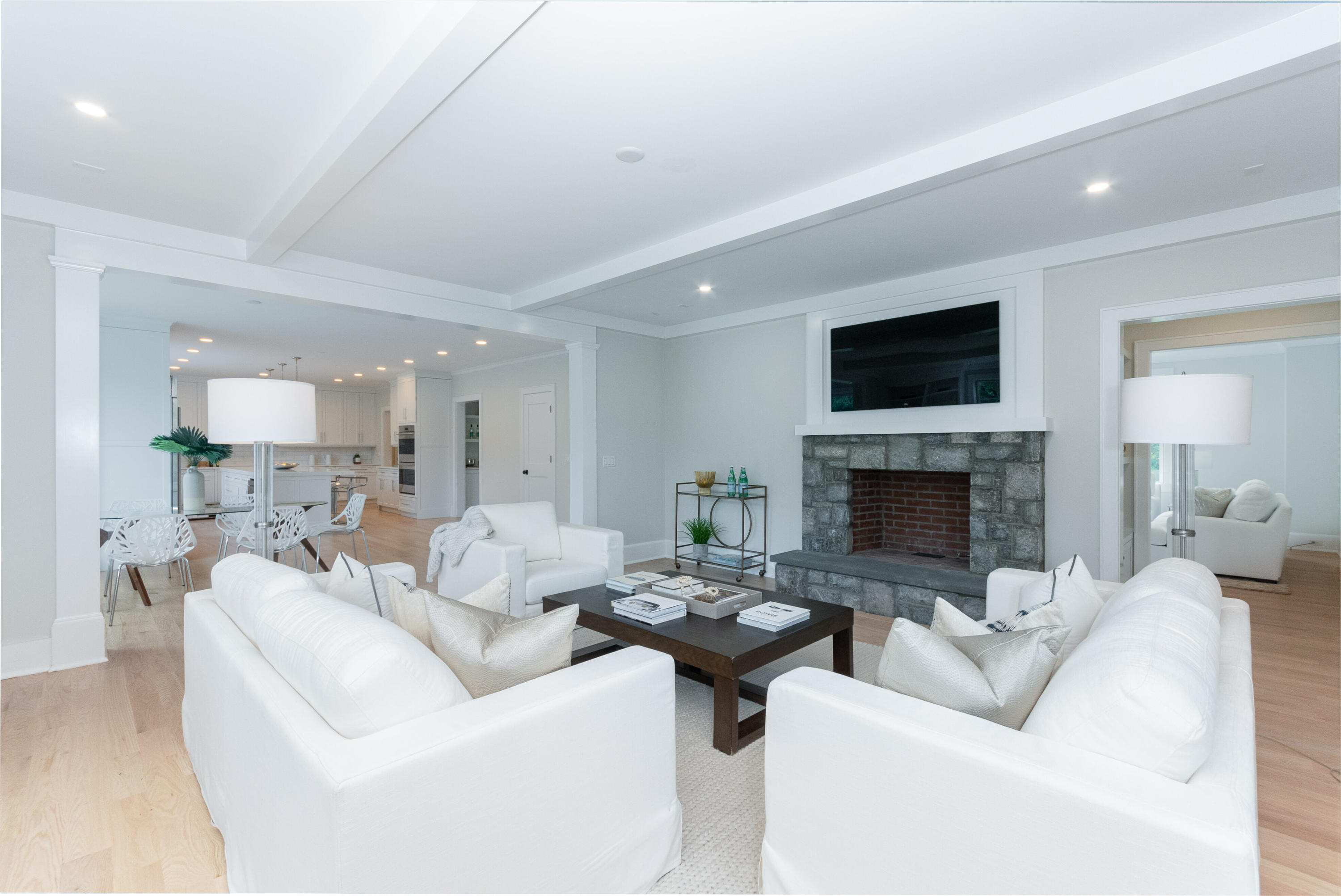 188 Brushy Ridge Road New Canaan, CT 06840 - Photo 13 of 32 a living room with furniture a fireplace and a flat screen tv