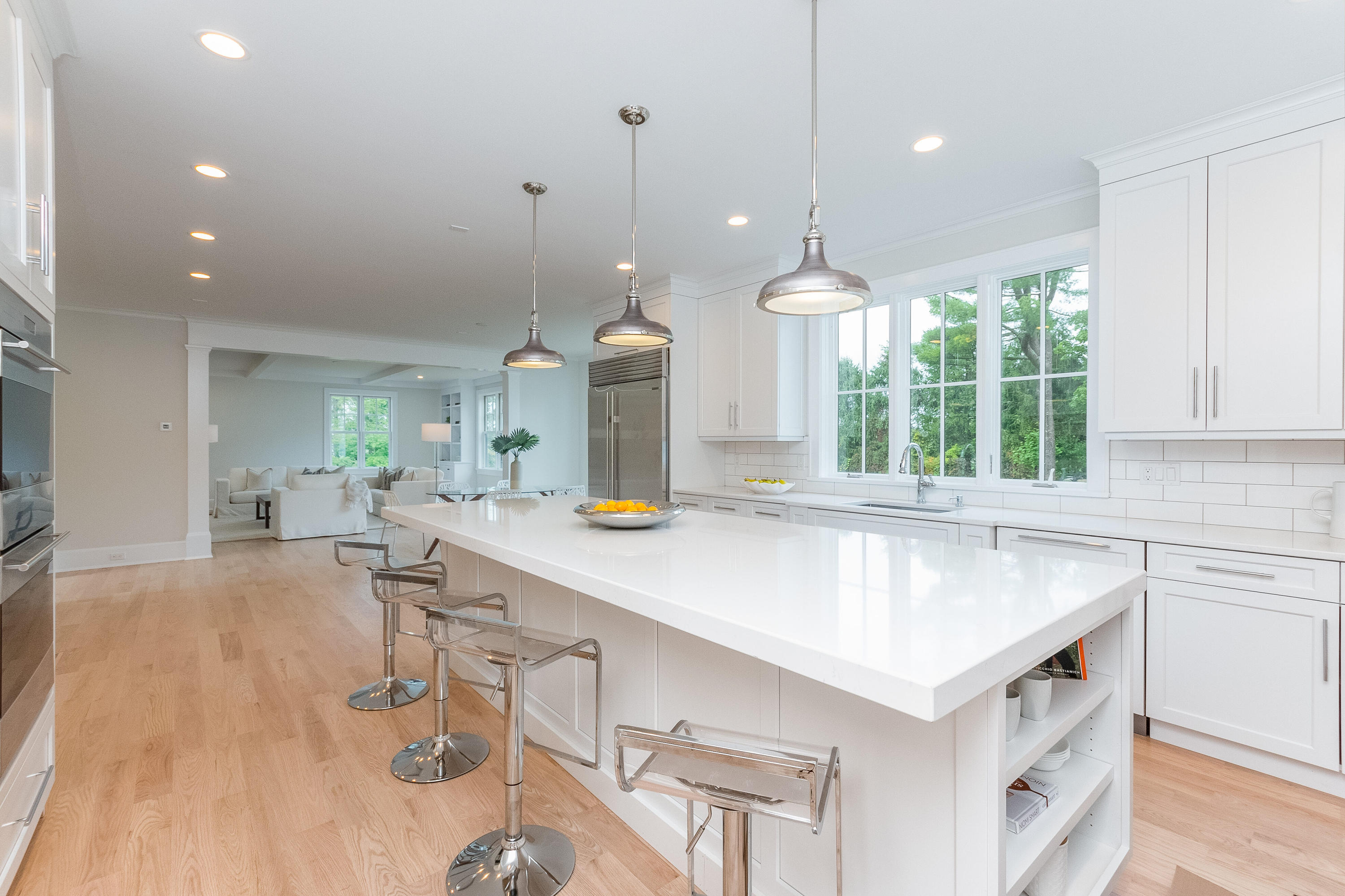 188 Brushy Ridge Road New Canaan, CT 06840 - Photo 14 of 32 a kitchen with a sink a counter top space and living room view