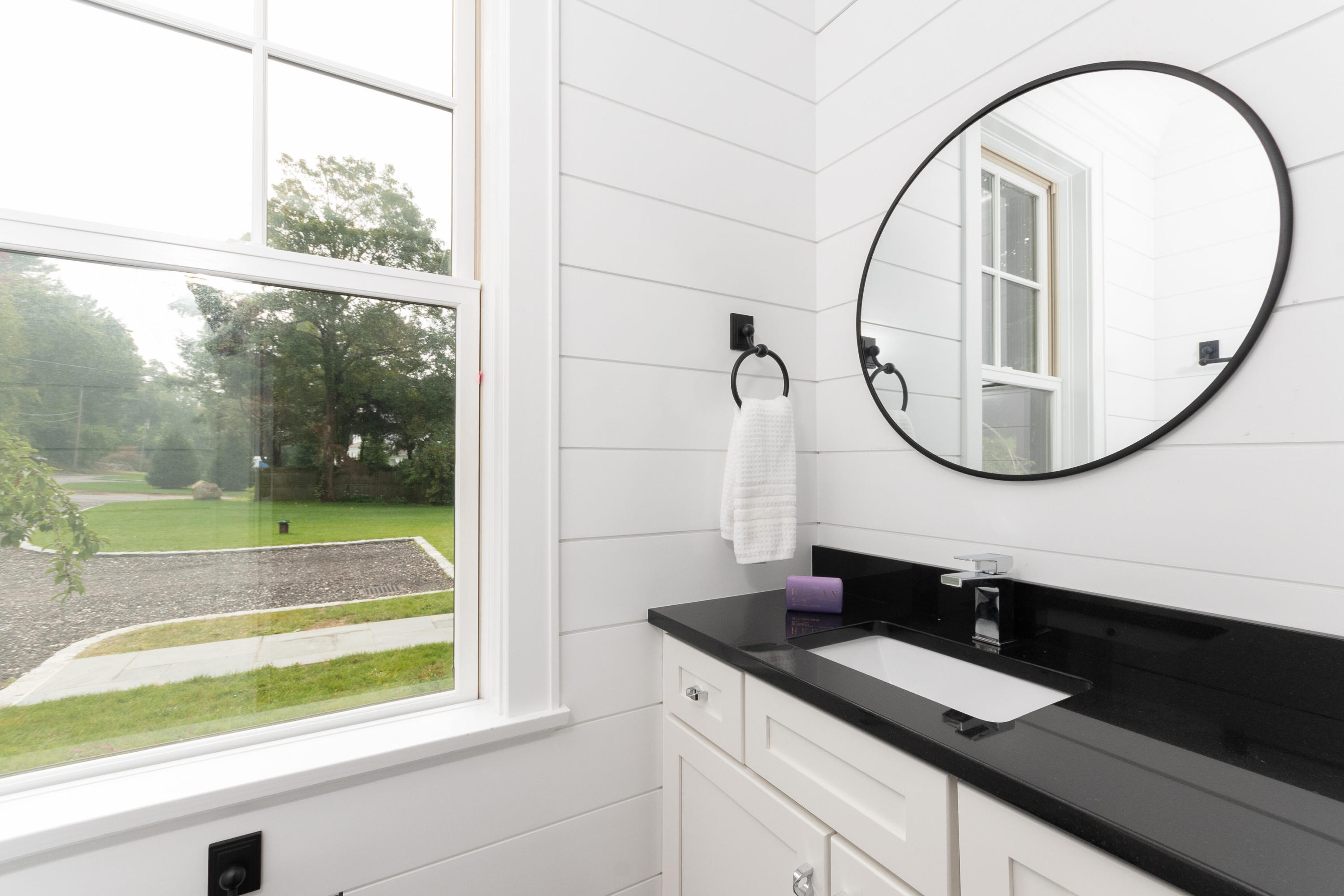 188 Brushy Ridge Road New Canaan, CT 06840 - Photo 20 of 32 a bathroom with a sink and a mirror