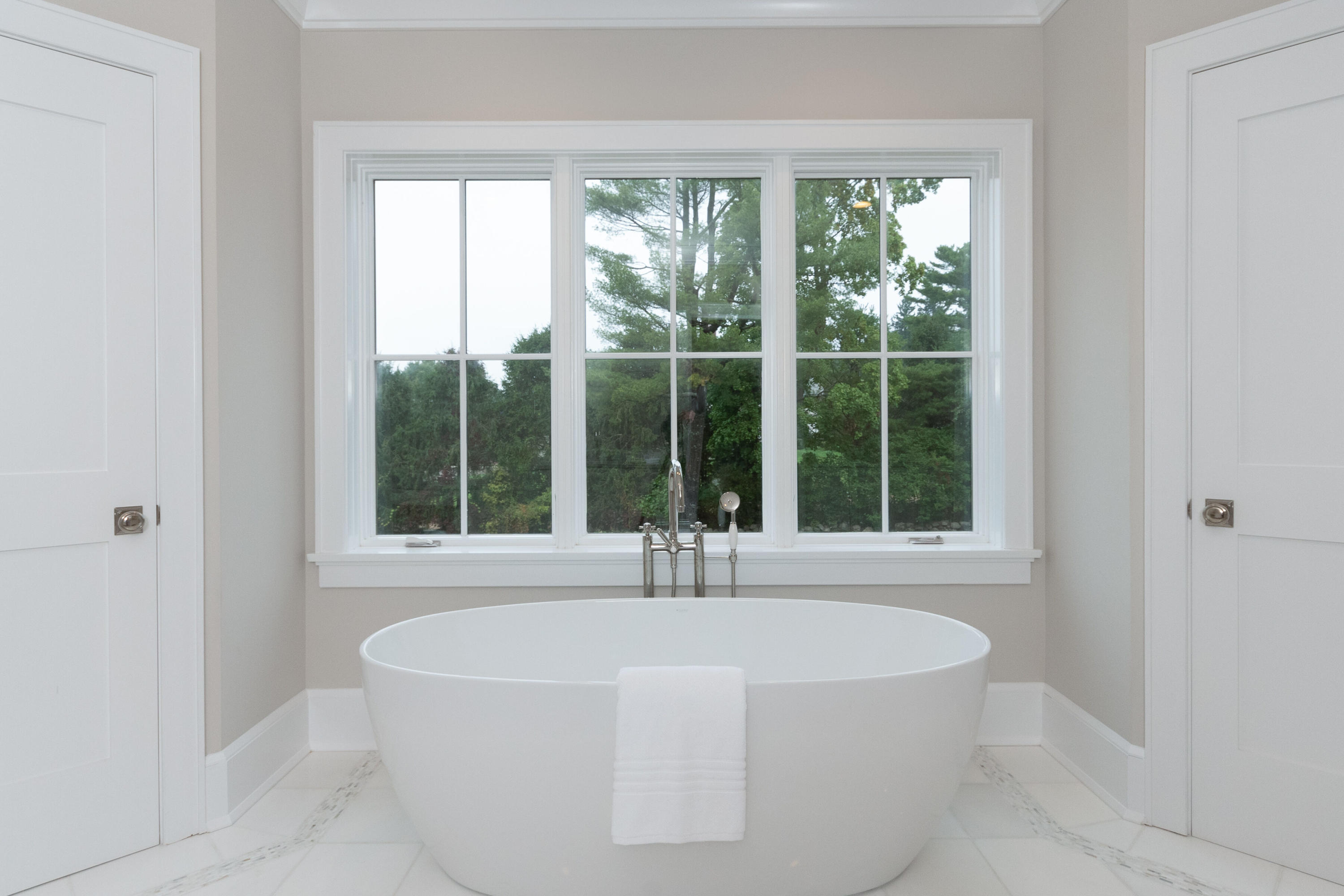 188 Brushy Ridge Road New Canaan, CT 06840 - Photo 24 of 32 a white bath tub sitting in a bathroom next to a window
