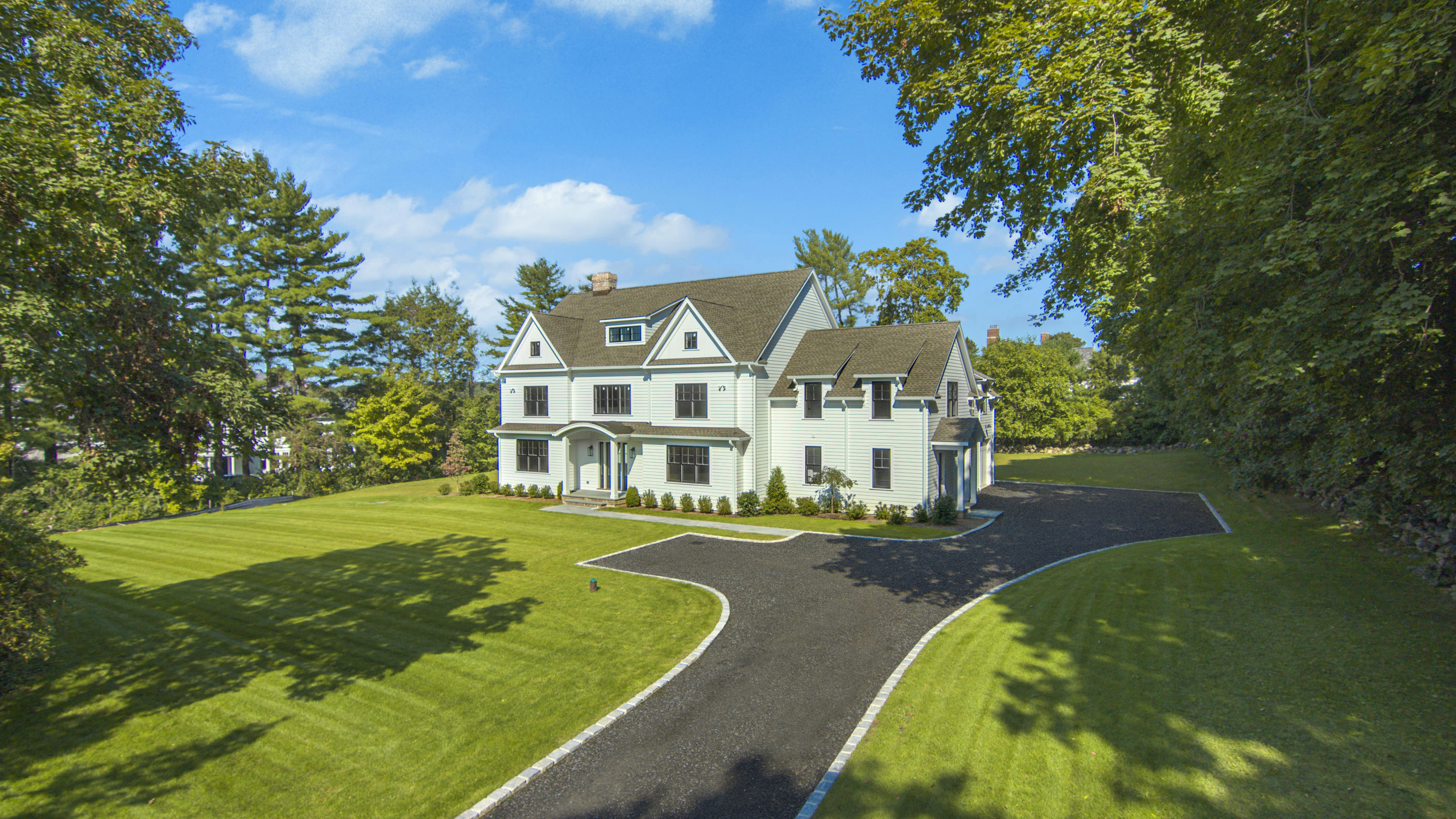 188 Brushy Ridge Road New Canaan, CT 06840 - Photo 28 of 32 a view of a swimming pool with a house in the background
