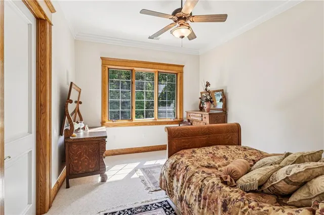 a bed room with a bed and a painting on the wall