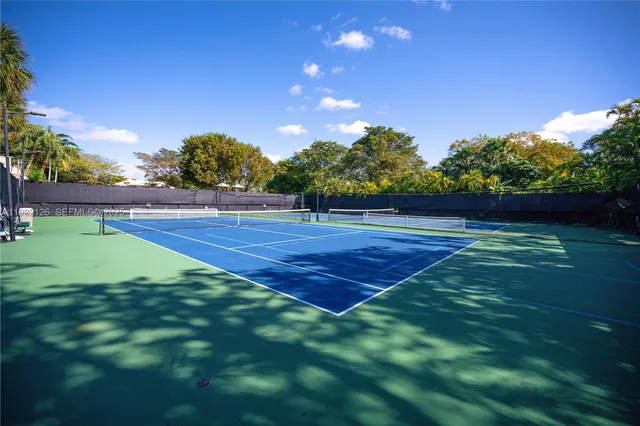 a view of an outdoor space and tennis court