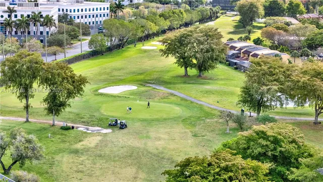 a swimming pool with trees in the background