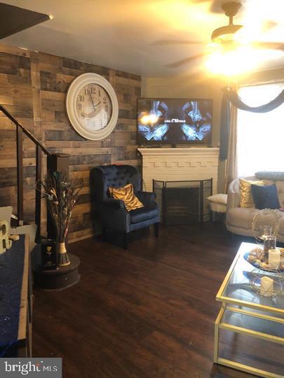 4539 Fernhill Road Philadelphia, PA 19144 - Photo 3 of 10 a living room with furniture a clock and a fireplace