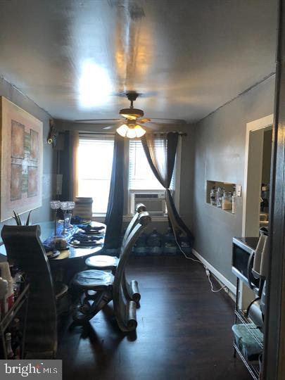 4539 Fernhill Road Philadelphia, PA 19144 - Photo 4 of 10 a room with furniture gym equipment and a flat screen tv