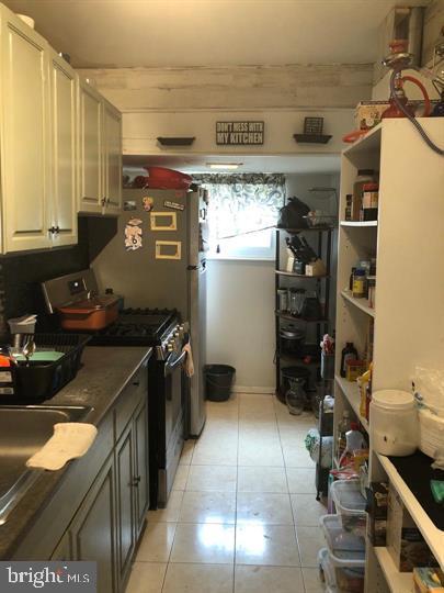 4539 Fernhill Road Philadelphia, PA 19144 - Photo 5 of 10 a kitchen with a sink appliances and cabinets