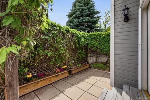a view of a backyard with sitting area