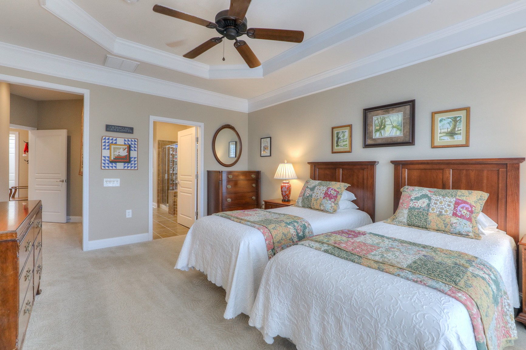 514 Bugler Road Mount Juliet, TN 37122 - Photo 22 of 45 a bedroom with a large bed and a chandelier