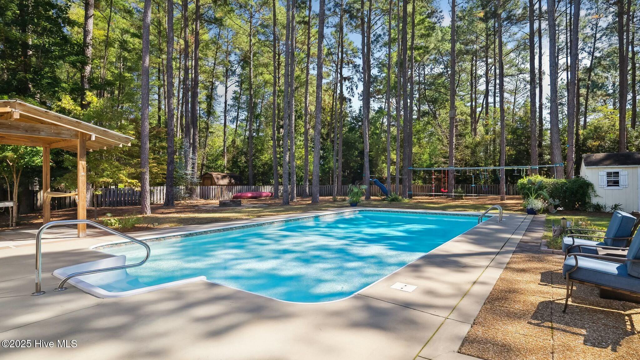 1215 Rays Bridge Road Whispering Pines, NC 28327 - Photo 43 of 54 Pool/Backyard